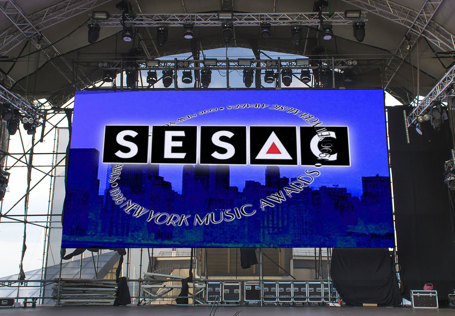 A large screen with the sesac logo on it.